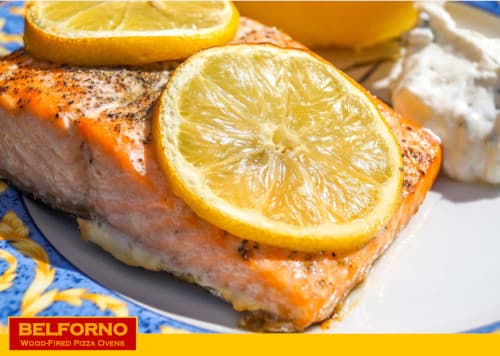 Cooked salmon with lemon garnish