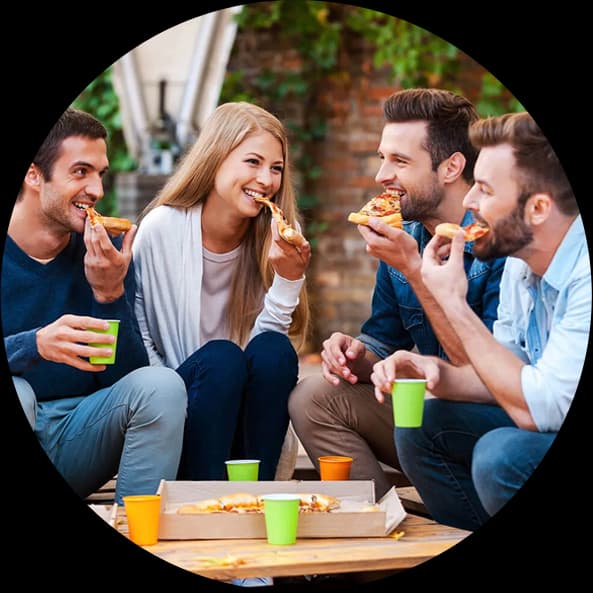 Friends enjoying food and drinks outdoors