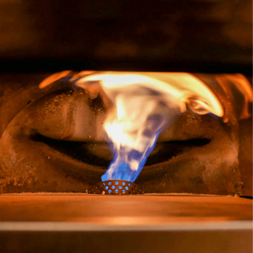 Blue flame in wood-fired oven