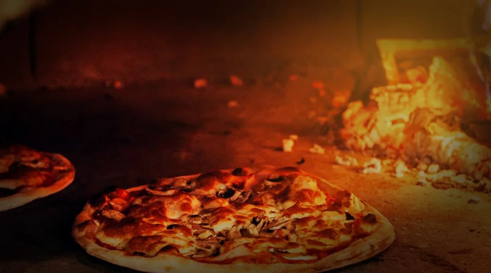 Fire in a Belforno wood-fired pizza oven